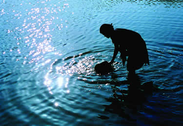 Silhouette of woman in water